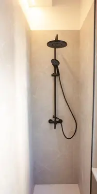 a shower in a bathroom with a shower head at Casa Monteverde near Trastevere and the city center in Rome