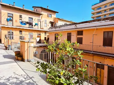 a row of buildings on a city street at Appartamento elegante con terrazzino a San Lorenzo in Rome