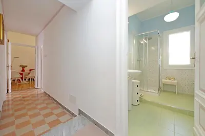 a bathroom with a walk in shower and a sink at 4BNB - Monteverde Chic & Comfort in Rome