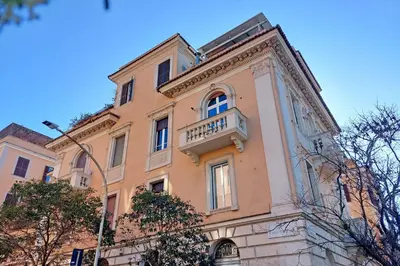 a building with a balcony on top of it at 4BNB - Monteverde Chic & Comfort in Rome