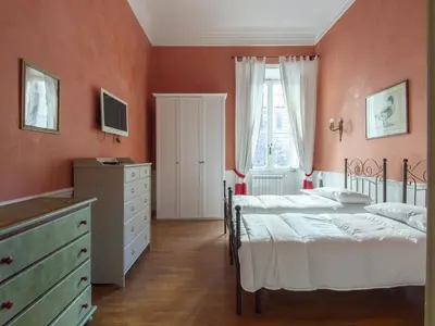a bedroom with two beds and a dresser at Apartment Plinio by Interhome in Rome