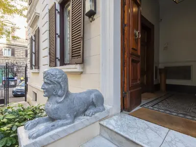 a statue of a woman sitting outside of a building at Apartment Plinio by Interhome in Rome