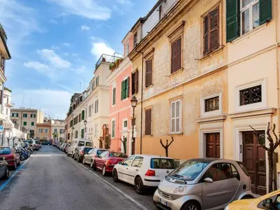 a street with cars parked on the side of the road at Apartment La Terrazza by Interhome in Rome