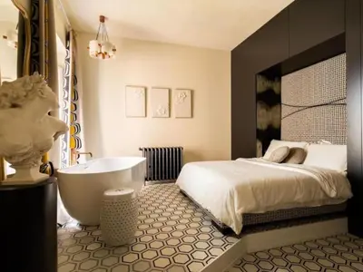 a bedroom with a large bed and a bath tub at Apartment La Dolce Vita by Interhome in Rome
