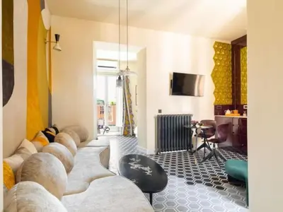 a living room with a couch and a table at Apartment La Dolce Vita by Interhome in Rome