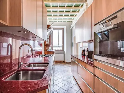a kitchen with stainless steel counters and a sink at Apartment Pantheon View by Interhome in Rome