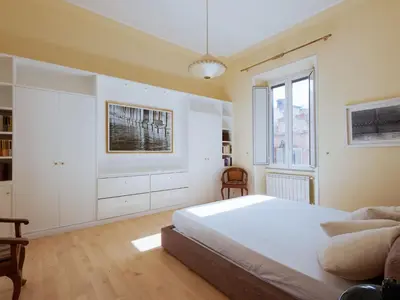 a bedroom with a large bed and a window at Apartment Babuino by Interhome in Rome