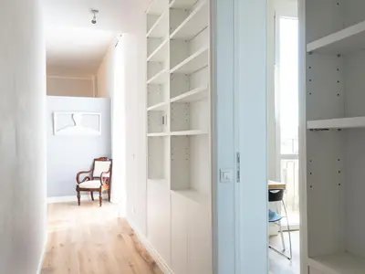 a hallway with white shelving in a house at Apartment Luminosa Vittoria by Interhome in Rome
