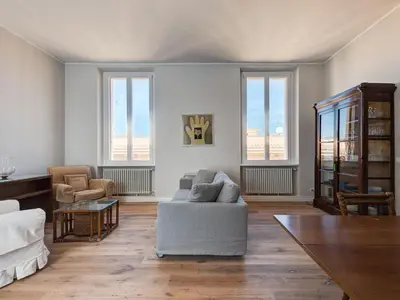 a living room with a couch and some windows at Apartment Luminosa Vittoria by Interhome in Rome