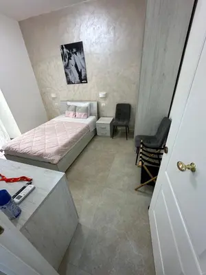 a small bedroom with a bed and a chair at YouRoominRome in Rome