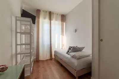 a living room with a couch and a window at YCH-Ponte Lungo apartment in Rome