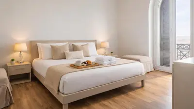 a bedroom with a bed with a tray of food on it at Vatican Pertusa Luxury Suites by Quinto Piano in Rome