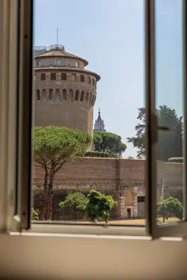 a view from a window of a tower at Vatican Pertusa Luxury Suites by Quinto Piano in Rome