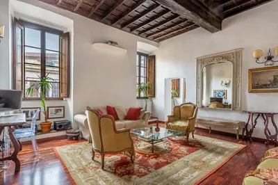 a living room with a couch and a table at iFlat A Vintage Gem Apartment near Piazza Navona in Rome
