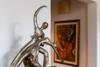 a metal statue of a giraffe in front of a painting at iFlat A Vintage Gem Apartment near Piazza Navona in Rome