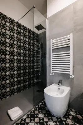 a bathroom with a white sink and a shower at B&B Lumas Up in Rome