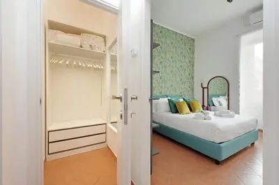 a small bedroom with a bed and a closet at Vatican 47 in Rome