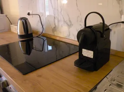 a tea kettle and a toaster on a counter at Il balconcino di Emma in Rome