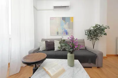 a living room with a couch and a table at Giuliana Vatican Family Home in Rome