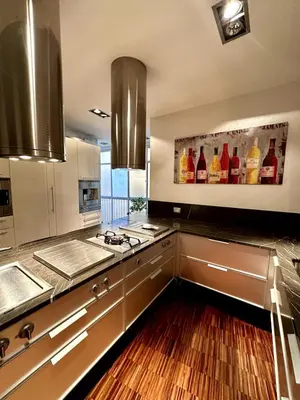 a kitchen with a bunch of bottles on the wall at Dimora XIX in Rome