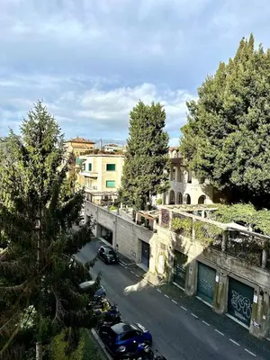 a view of a street with cars parked on the road at Dimora XIX in Rome