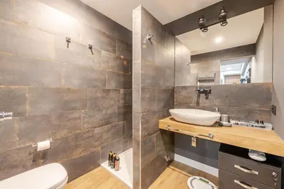 a bathroom with a sink and a toilet and a mirror at Appartamento My Happy Place Rome in Rome