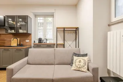 a living room with a couch in a kitchen at Appartamento My Happy Place Rome in Rome