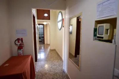 a hallway with a mirror and a tv on a wall at Domi 10 Apartment, Stazione Termini, Via Curtatone 12 in Rome