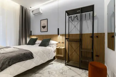 a bedroom with a bed and a glass closet at Arte di Roma - Guest House in Rome