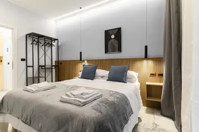 a bedroom with a large bed with towels on it at Arte di Roma - Guest House in Rome