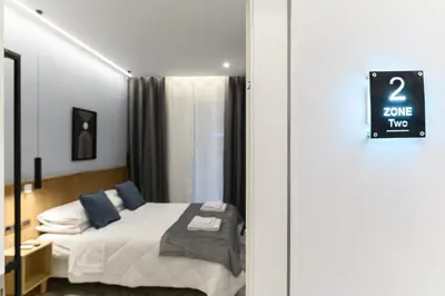 a bedroom with a bed and a sign that says save two at Arte di Roma - Guest House in Rome
