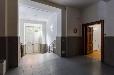 an empty room with a door and a hallway at 3-Bedroom Home Near Trastevere Station in Rome