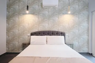 a bedroom with a bed and a wall mural at Domus Matris Guest House in Rome