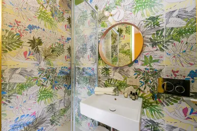 a bathroom with a sink and a mirror at Moon River Luxury Apartment in Rome
