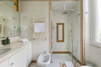 a bathroom with a shower and a sink at Family Stay in Trastevere in Rome
