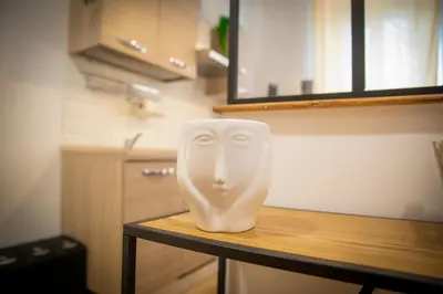 a white head statue sitting on top of a table at Casa Stefano at the Vatican comfort in the Heart of Rome in Rome