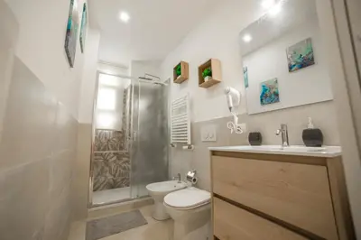 a bathroom with a shower and a toilet and a sink at Casa Stefano at the Vatican comfort in the Heart of Rome in Rome