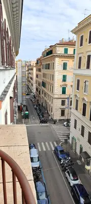 a view of a city street with parked cars at House Fenicia in Rome