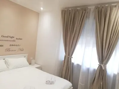 a bedroom with a bed and a window at New Jebs sweet home Rome in Rome