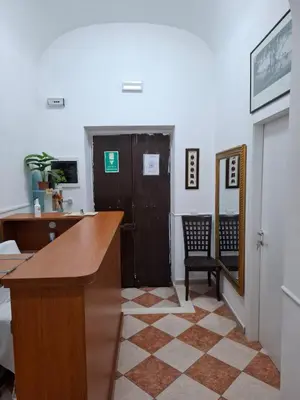 an office with a desk and a door and a mirror at AFFITTACAMERe ROME PALACE in Rome