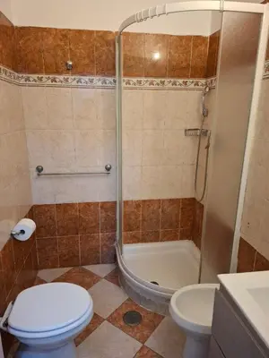 a bathroom with a shower and a toilet and a sink at AFFITTACAMERe ROME PALACE in Rome