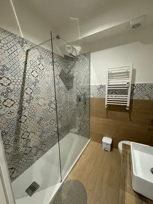 a bathroom with a shower and a sink at Suite Rooms Garbatella in Rome