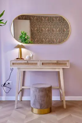 a dressing table with a mirror and a stool at Amelie - Gem of Trastevere in Rome