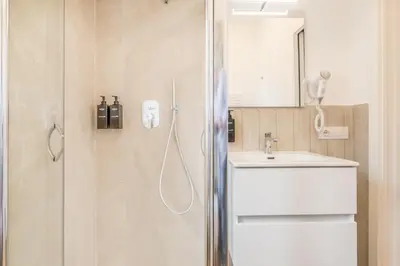 a bathroom with a shower and a sink at Domvs Romana in Rome