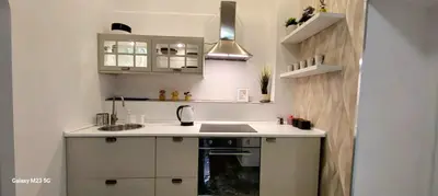 a small kitchen with a sink and a stove at Rome Center Bello Loft in Rome
