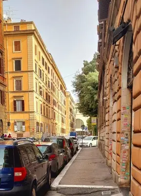 a city street with parked cars and buildings at Rome Center Bello Loft in Rome