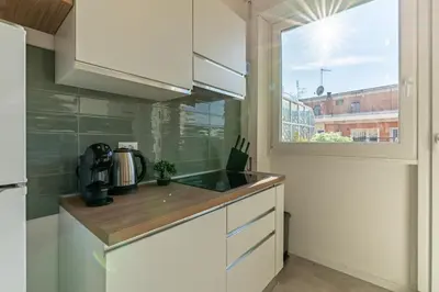 a kitchen with a sink and a window at Domvs Tibvrtina - Solarium Zone, Terrace, A-C, Roma in Rome