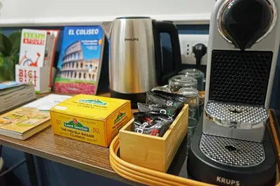 a table with a coffee maker and a blender at Stay Smart Termini Esquilino in Rome