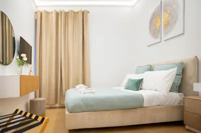 a bedroom with a bed with blue and white at Sette Chiese Apartment in Rome