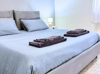 two brown towels sitting on top of a bed at Casa vacanze Roma Adelaide's house in Rome